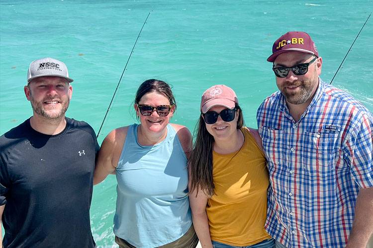 group of 4 people on a boat