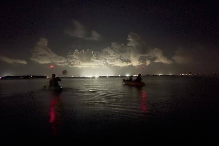 two kayaks on dark ocean