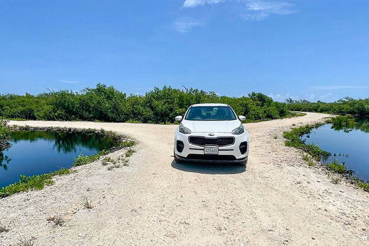 car on gravel road car on gravel road