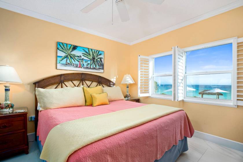 condo bedroom with ocean view