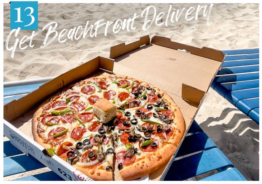 pizza on lounge chair at beach