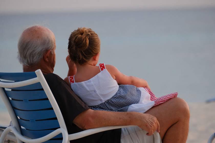 grandpa and grandaughter on beach