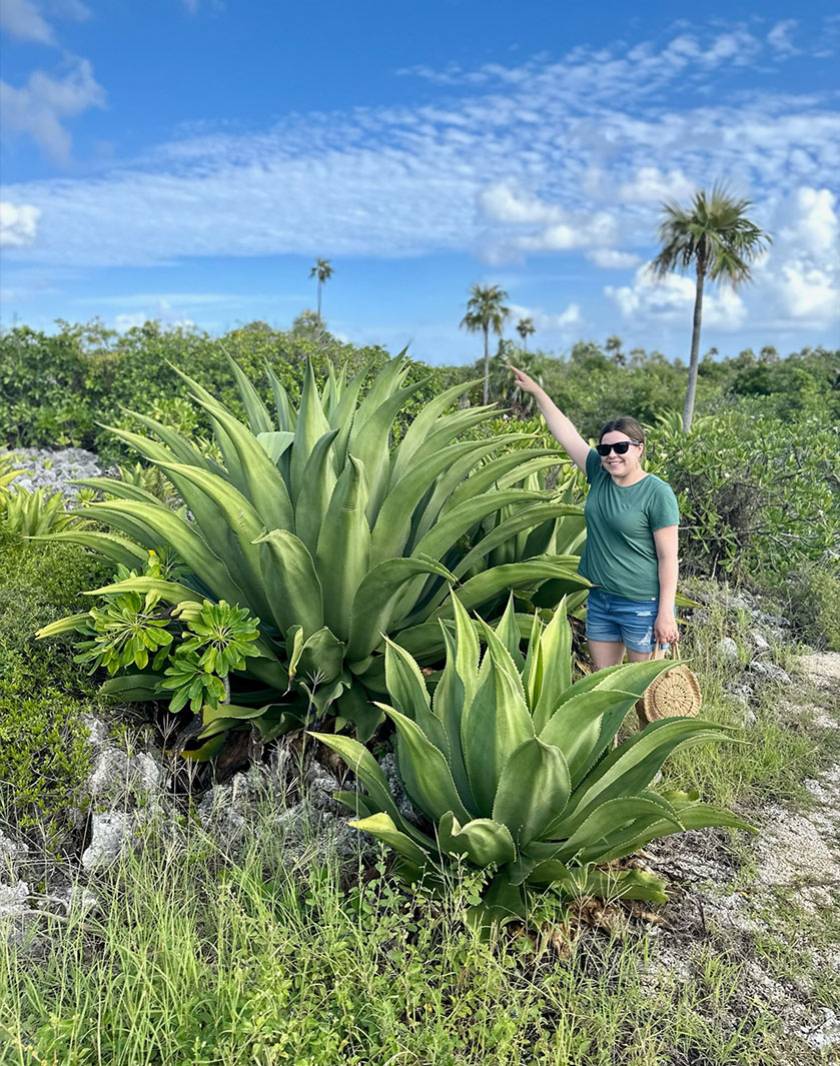 woman next to agave taller than her