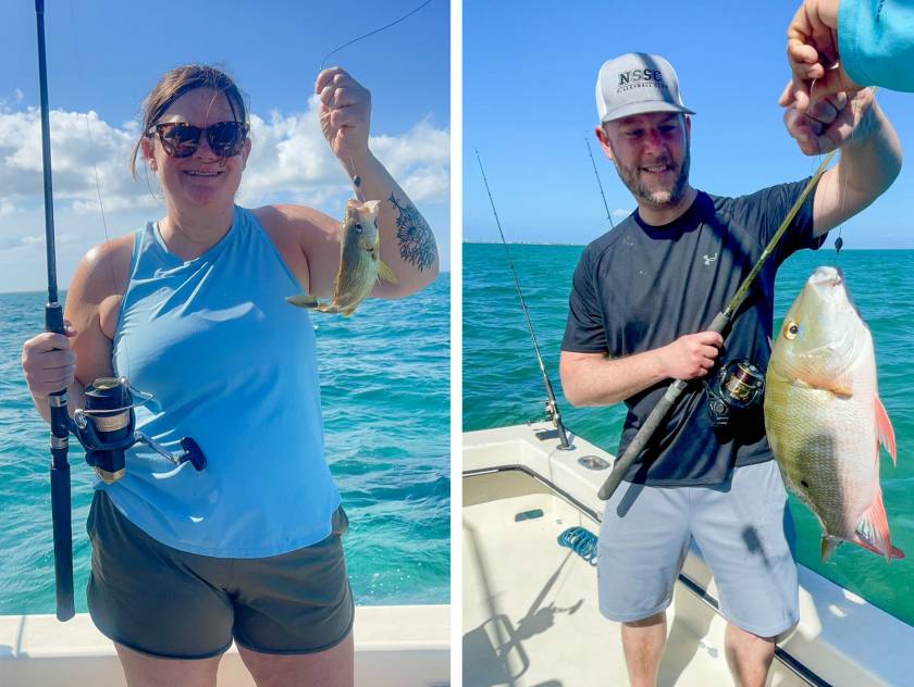 woman and man holding fish caught on charter