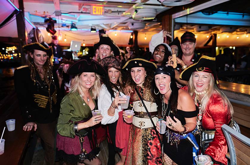 people in pirate costumes having fun