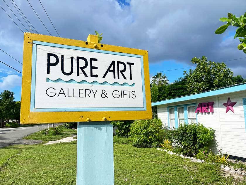 handmade sign outside of pure art