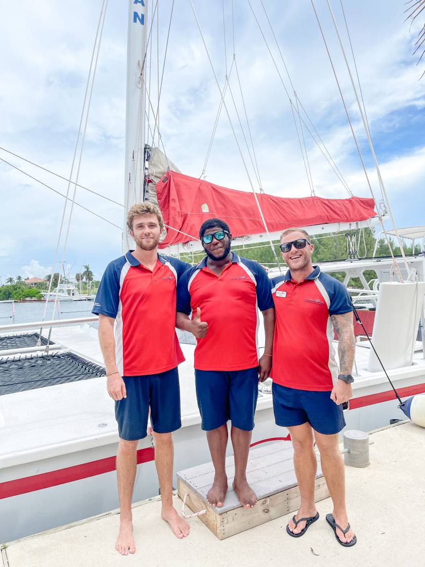 crew in front of boat