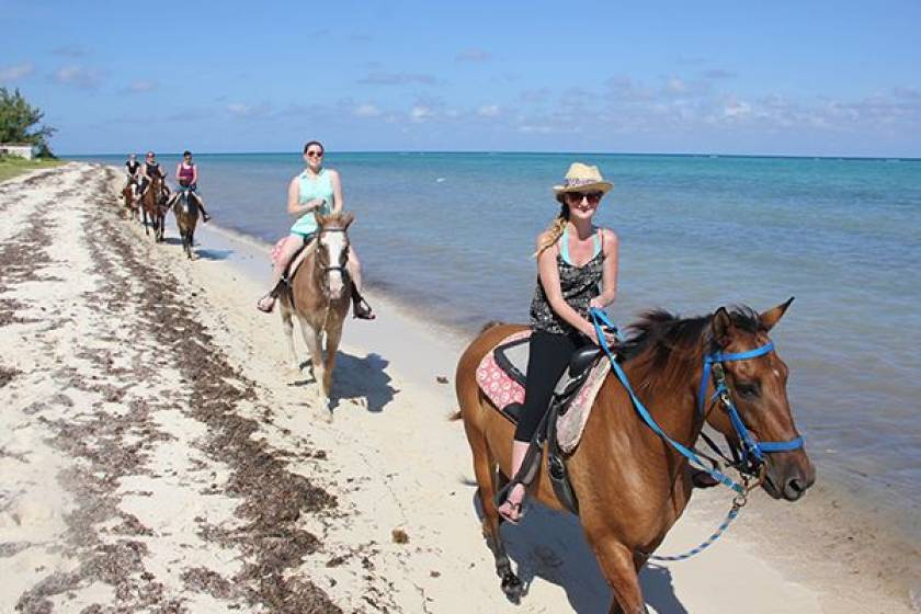 riding horses on beach