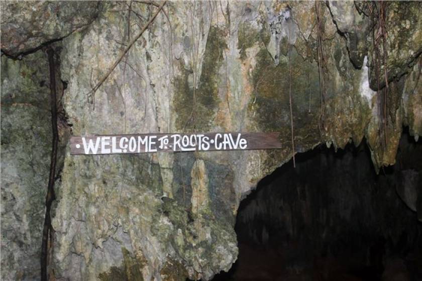 sign for Roots Cave