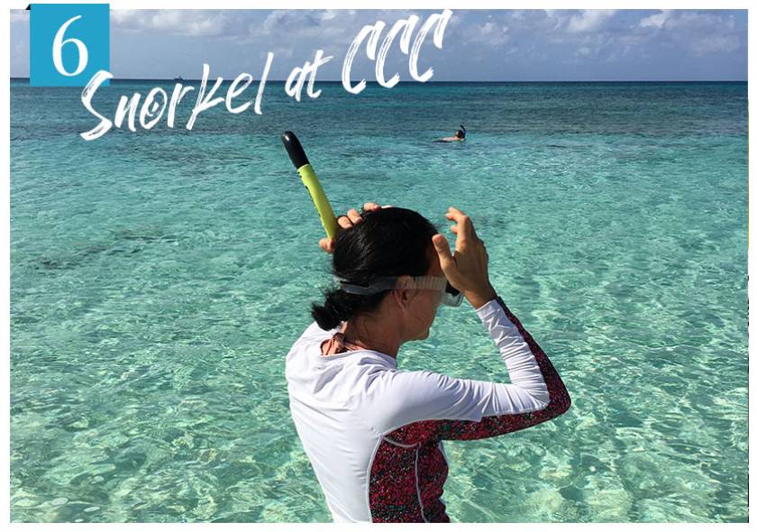 snorkeler entering ocean