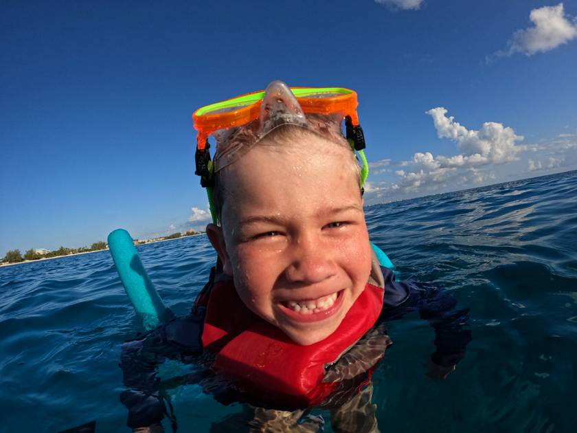 kid snorkeling in grand cayman