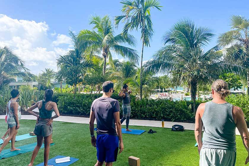 yoga instructor leading class outside