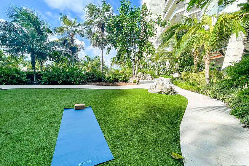 yoga mat under palm trees